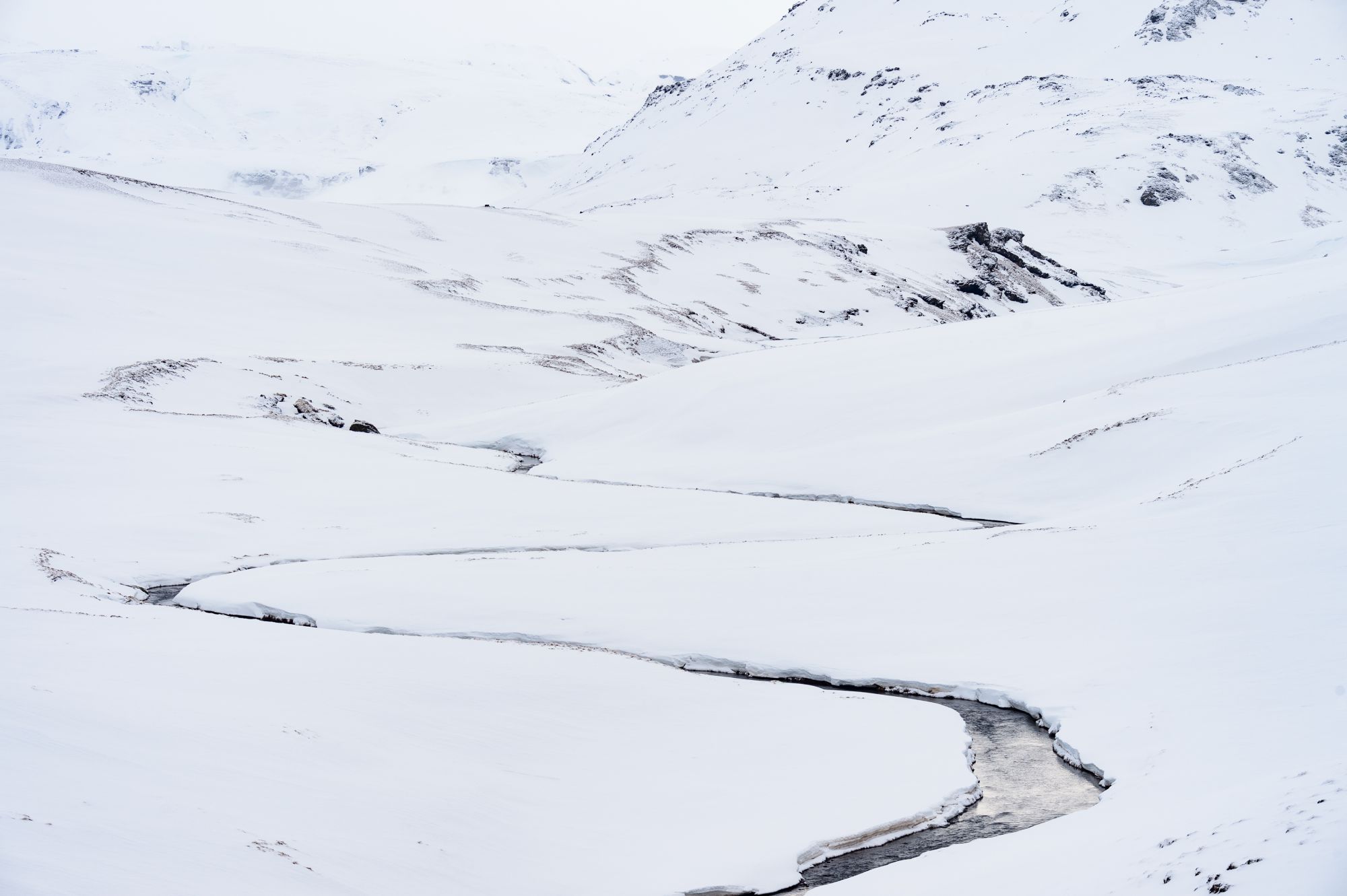 River meandering through the snow